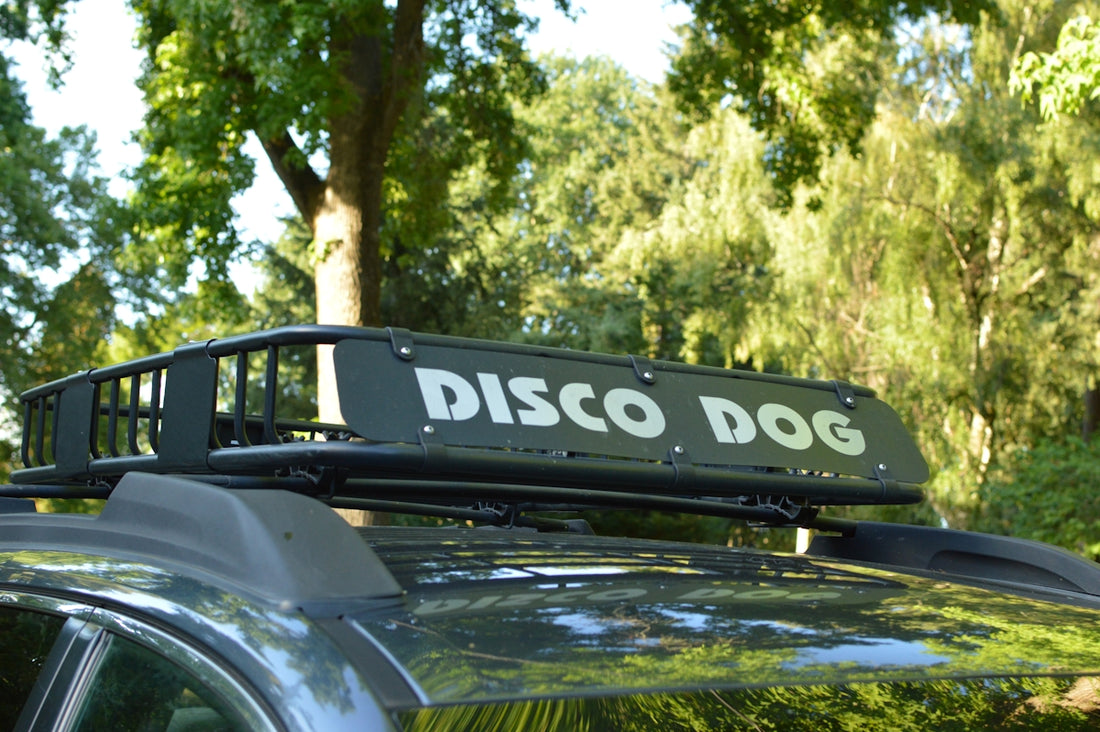 Car roof rack with a disco dog sign